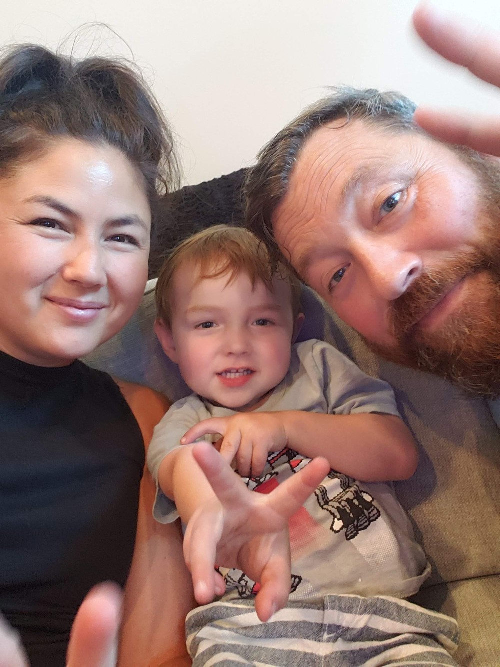 A person and person taking a selfie with a baby

Description automatically generated